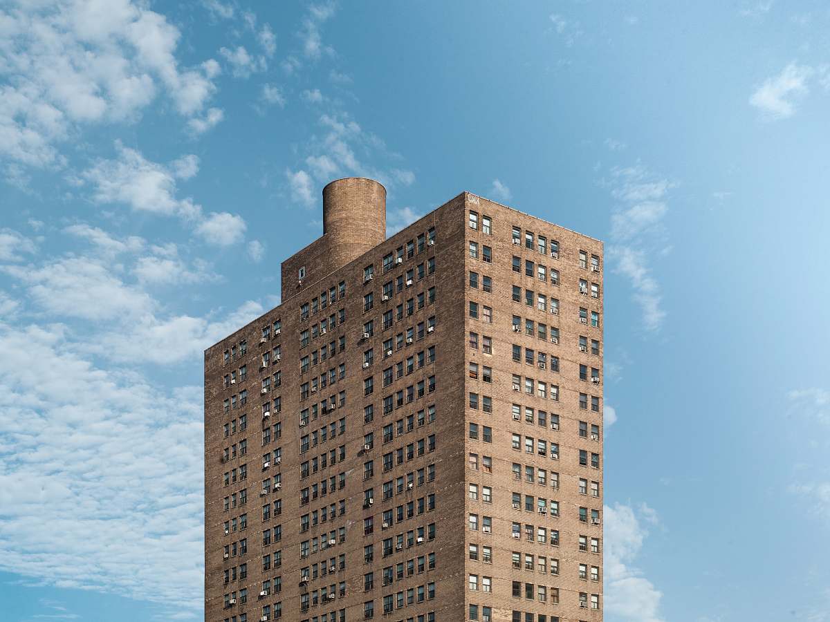 building brown apartment-type building housing